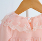 Preview: Süsses Babykleidchen, langärmlig mit kleiner Teddy-Brosche, offwhite oder rosa