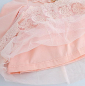 Preview: Süsses Babykleidchen, langärmlig mit kleiner Teddy-Brosche, offwhite oder rosa